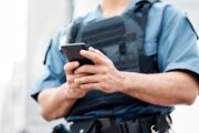officer holds phone